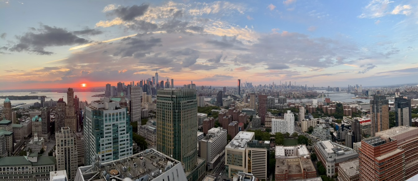 New York City skyline at sunset, viewed from above Lower Manhattan.