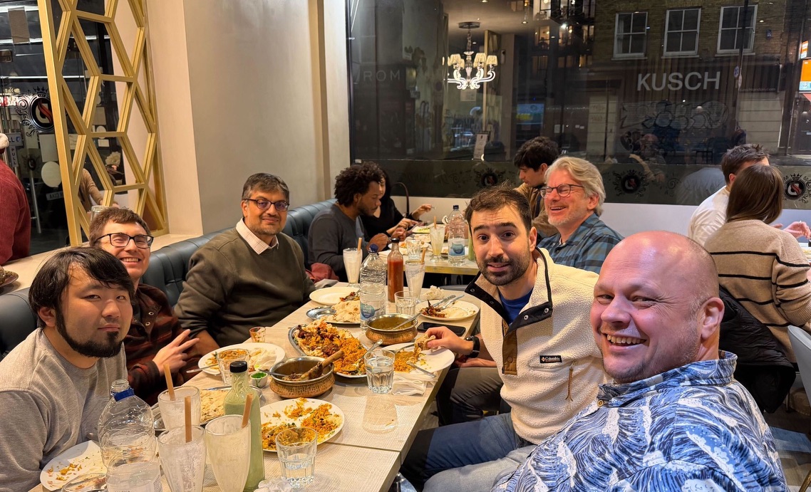 Colleagues share dinner together at a restaurant