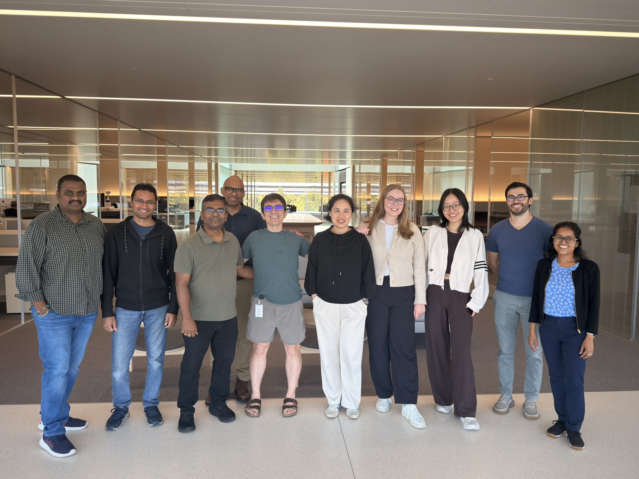 Ten colleagues standing together in an Apple office