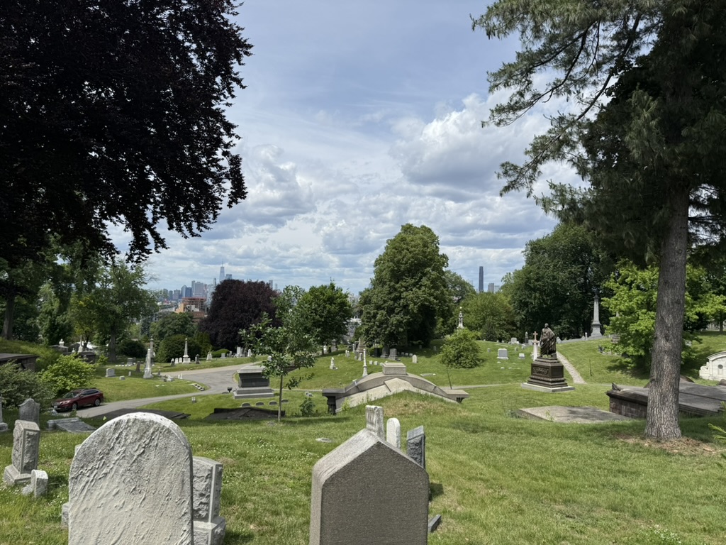 New York City seen beyond a hillside cemetery